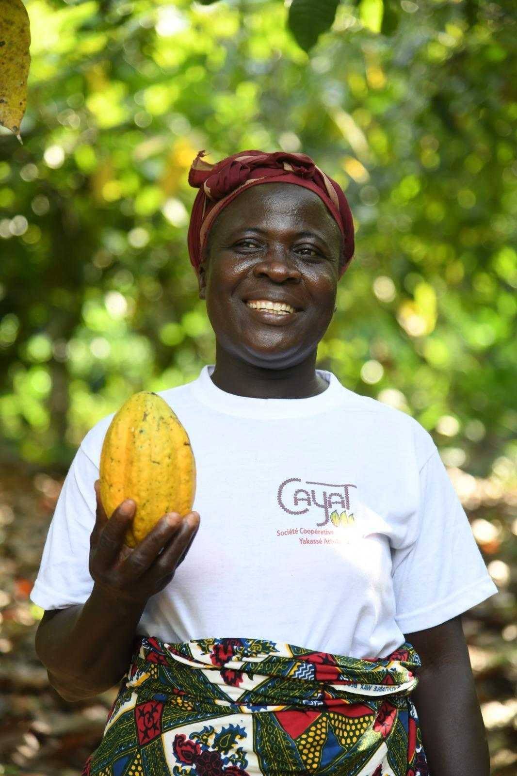 Farmer holding a cocoa pod